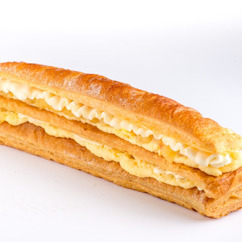 A Corica apple strudel, its flaky pastry layered with apple, custard and cream